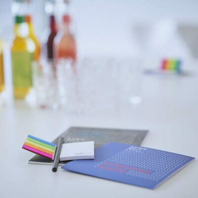 Conferences in the FREIRAUM | Photo: Nikolaus Frank Pen, information material and drinks on a conference table