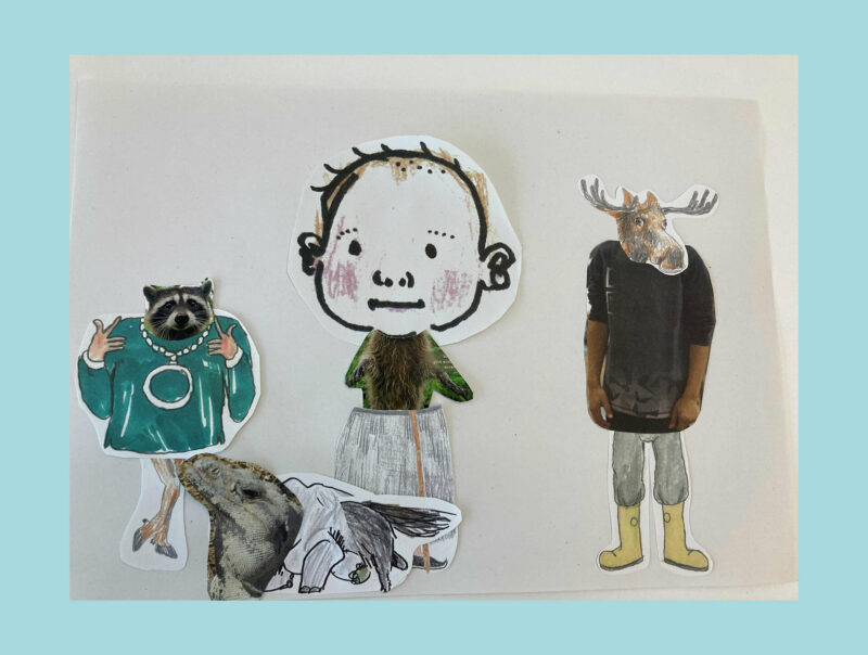 Workshop ERZAEHLENHOEREN | Collage Fantasiewesen Fantasiewesen, die mittels Collage gestaltet wurden, wie ein Elchkopf auf einem Wollpullover mit gelben Gummistiefeln.